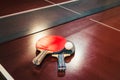 Table tennis rackets and ball, net background Royalty Free Stock Photo