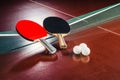 Table tennis rackets on the net and balls Royalty Free Stock Photo