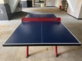 a table tennis table in the leisure area of the apartment