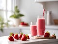 On the table there is a glass of strawberry smoothie, on the glass as a decoration appetizing strawberries,