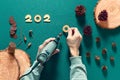 On the table there is a production of wooden figures for the celebration of the new year and Christmas using an electric engraver