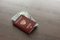 On the table there is a Russian passport inside various dollar bills and small change. finance Royalty Free Stock Photo