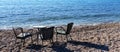 Table for three persons on a beach