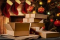 Christmas decorations and gift boxes, parcels with blurred christmas tree and fireplace background.