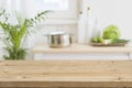 Table top with blurred kitchen interior as background Royalty Free Stock Photo