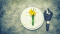 Table top with cutlery, napkin, spring flowers Royalty Free Stock Photo