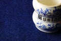 OLD GLAZED CERAMIC WHITE AND BLUE MUSTARD POT Royalty Free Stock Photo