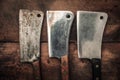 Table top picture of three vintage cleavers