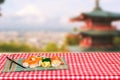 Table top on sushi background. Close-up of various kinds of sushi and chopsticks served on green bamboo mat on a red checkered Royalty Free Stock Photo