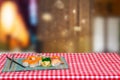 Table top on sushi background. Closeup of various kinds of sushi and chopsticks served on green bamboo mat on a red checkered Royalty Free Stock Photo