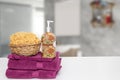 Table top on towels background. Closeup of fresh soft terry bath towels with soap bottle and basket with a natural sponge on table Royalty Free Stock Photo