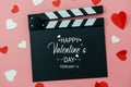 Table top view aerial image of decoration valentine`s day background concept.Flat lay essential items colorful love shape paper