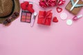 Table top view aerial image of decoration valentine`s day background concept.Flat lay essential items red heart & gift box on