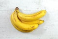 Table top view, bunch of ripe bananas on white working board