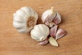 Table top view on garlic bulbs, purple cloves, some of them peel Royalty Free Stock Photo