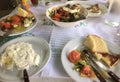 Table top view in a Taverna showing a Greek Salad and Tzatziki with Toasted Bread, Githio, Greece Royalty Free Stock Photo