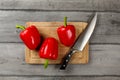 Table top view - three bright red bell peppers, water drops, wit Royalty Free Stock Photo