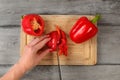 Table top view - woman hands, cutting red bell pepper with chefs Royalty Free Stock Photo