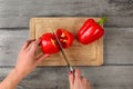 Table top view - woman hands holding chefs knife, cutting red be Royalty Free Stock Photo