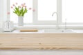Table top of wood on blurred kitchen sink window background Royalty Free Stock Photo