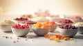 a table topped with bowls filled with different types of food next to a white table cloth covered in cereals and other foodstuffs