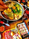 A table topped with lots of different types of food. overflowing feast buffet table and hot food.