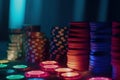 a table topped with lots of lit candles next to stacks of poker chips