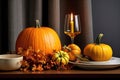 A Table Topped With A Plate Of Pumpkins And A Glass Of Wine