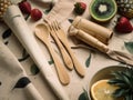 A table topped with wooden utensils and fruit. AI generative image.