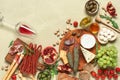 Table with traditional Spanish, Italian snacks and wine. Mediterranean food. Concrete beige background. Top view, flat lay