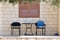 Table with two chairs in front of house Royalty Free Stock Photo