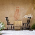 Table and two chairs near the wall