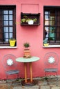 Table with two chairs at a pink house Royalty Free Stock Photo