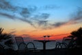 Table with two glasses of wine on sunset on sea Royalty Free Stock Photo