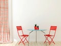 Table with two red chairs Royalty Free Stock Photo