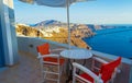 Table for two Santorini Caldera cliff top panoramic balcony Greece Royalty Free Stock Photo