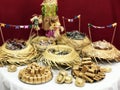 Table of typical food of junina party: paÃÂ§oca candy, lollipops, cake, dulce de leche, peanut candy. Tradicional Festa Junina