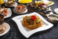 Table with typical Indian dishes, Biryani, chicken curry, tandoori, tikka masala, korma, rice pilau Royalty Free Stock Photo