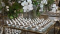 A table with a variety of desserts and flowers