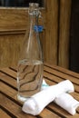 Table Water in Glass Bottle with Two Napkins