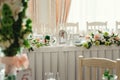 Table at a wedding feast decorated with bridal bouquets Royalty Free Stock Photo