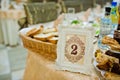 Table of wedding reception with delicious food and number 2. Royalty Free Stock Photo