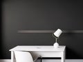 A table and a white lamp are set against a black, textured wall in this lovely minimalist presentation background. Royalty Free Stock Photo