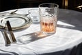 a table with a white napkin and silverware Royalty Free Stock Photo