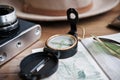 Table whith passport, vintage camera, compass, sunglasses and hat. Royalty Free Stock Photo
