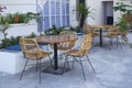 Table & wicker rattan chair in cafe restaurant