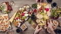 Table with wine appetize and cheese plates, top view. Time lapse,