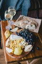 Table with wine, cheese, bread, grapes and pears Royalty Free Stock Photo
