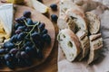 Table with wine, cheese, bread, grapes and pears Royalty Free Stock Photo