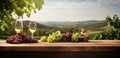 a table with wine and grapes sitting in front of vineyard Royalty Free Stock Photo